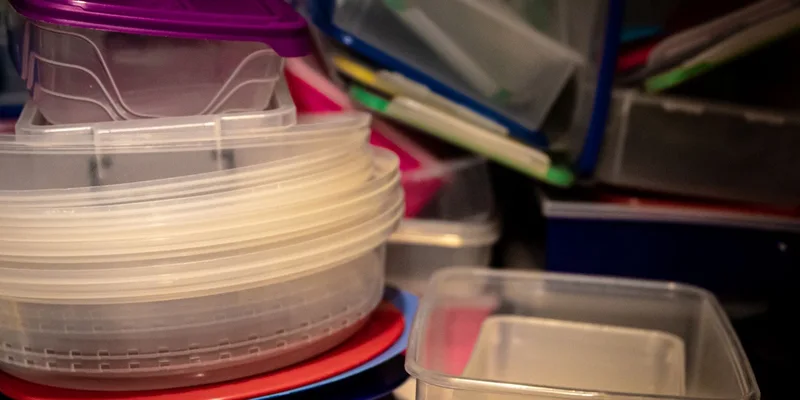 A variety of plastic storage containers stacked together