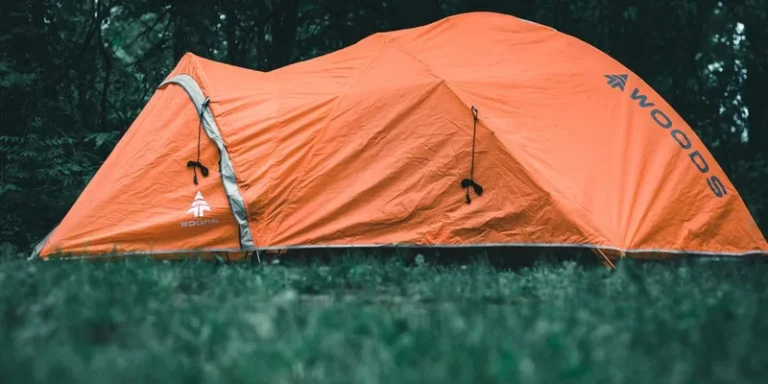 Bright orange tent in a Canadian forest